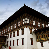 Buy canvas prints of Buddhist Monk of Tashi Chho Dzong Fortress, Bhutan by Julian Bound