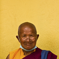 Buy canvas prints of Elderly Tibetan Buddhist monk, Boudhanath, Kathman by Julian Bound