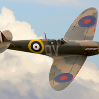 Buy canvas prints of  Spitfire in the Clouds by Steve Smith