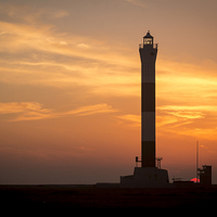 Buy canvas prints of Sunset behind the Lighthouse by Steve Smith