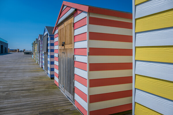 Huts on the pier. Picture Board by Bill Allsopp