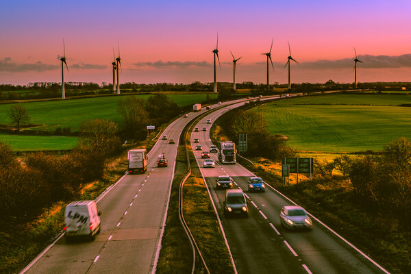 Sunset over a busy A46. Picture Board by Bill Allsopp