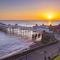 Buy canvas prints of Sunrise over Cromer pier on the Norfolk coast. by Bill Allsopp