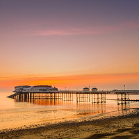 Buy canvas prints of Cromer pier at sunrise. by Bill Allsopp