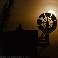 Buy canvas prints of Cley windmill silhouette with full moon fantail by Simon Bratt LRPS