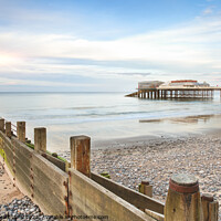 Buy canvas prints of Cromer Pier in Norfolk England with beach groin by Simon Bratt LRPS