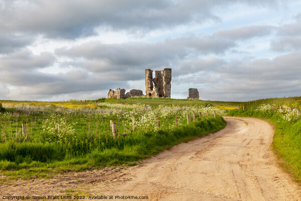 Winding road leading to a chirch ruin in Norfolk Picture Board by Simon Bratt LRPS
