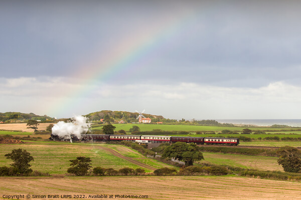 Norfolk steam train with Weybourne windmill and rainbow Picture Board by Simon Bratt LRPS
