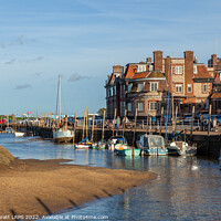 Buy canvas prints of Blakeney quay harbour in Norfolk low tide by Simon Bratt LRPS