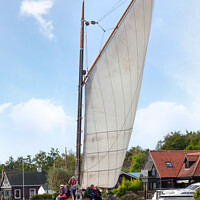 Buy canvas prints of One Wherry sail boat on the Norfolk Broads UK by Simon Bratt LRPS