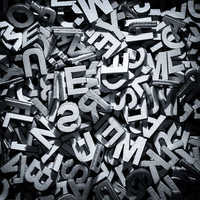 Buy canvas prints of Monochrome letters in a pile by Simon Bratt LRPS