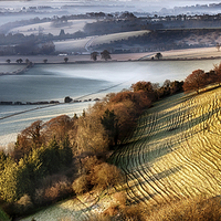 Buy canvas prints of Dawn breaking over wrinkled hill by Simon Bratt LRPS