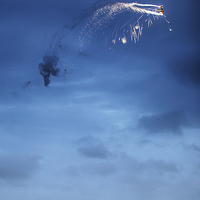 Buy canvas prints of Pyrotechnics plane over ship by Simon Bratt LRPS