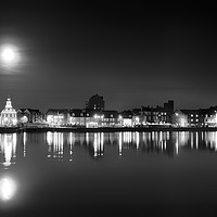 Buy canvas prints of Supermoon rising over Norfolk town UK by Simon Bratt LRPS