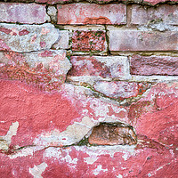 Buy canvas prints of Grunge red wall with broken plaster close up by Simon Bratt LRPS