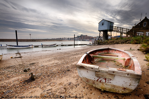 Old rowing boat and lookout tower on beach Picture Board by Simon Bratt LRPS