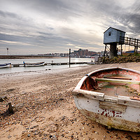 Buy canvas prints of Old rowing boat and lookout tower on beach by Simon Bratt LRPS