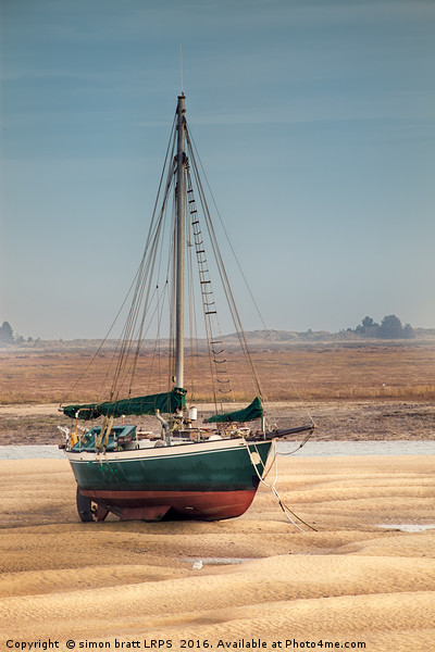 Sail boat stranded at low tide on sand Picture Board by Simon Bratt LRPS