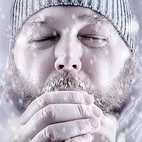 Buy canvas prints of Man freezing in snow storm white out close up by Simon Bratt LRPS