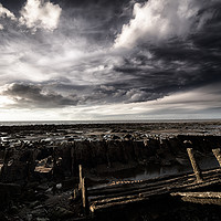 Buy canvas prints of Storm clouds over beached shipwreck by Simon Bratt LRPS