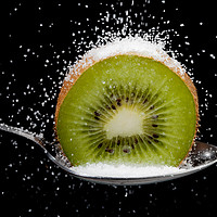 Buy canvas prints of Kiwi fruit cut in half on a spoon with sugar by Simon Bratt LRPS