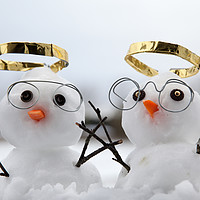 Buy canvas prints of Two cute snowman angles with golden halos by Simon Bratt LRPS