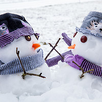 Buy canvas prints of Two cute snowmen friends embracing by Simon Bratt LRPS