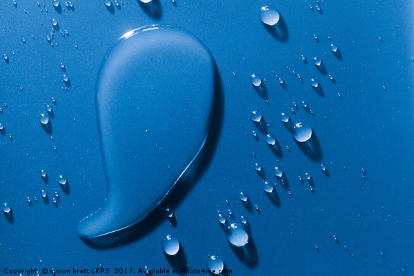 Large and small water droplets viewed from above Picture Board by Simon Bratt LRPS