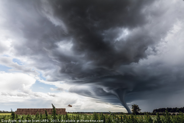Storm tornado or twister lifting hay bales in stor Picture Board by Simon Bratt LRPS