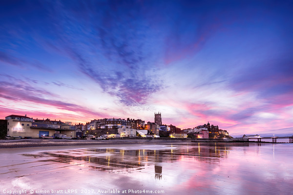 Cromer pier and town in Norfolk with pink sunset Picture Board by Simon Bratt LRPS