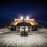Buy canvas prints of Cromer pier pavilion at night in Norfolk by Simon Bratt LRPS
