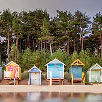 Buy canvas prints of Beach hut row on the Norfolk coast by Simon Bratt LRPS