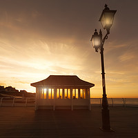 Buy canvas prints of Cromer pier Norfolk shelter at sunset by Simon Bratt LRPS