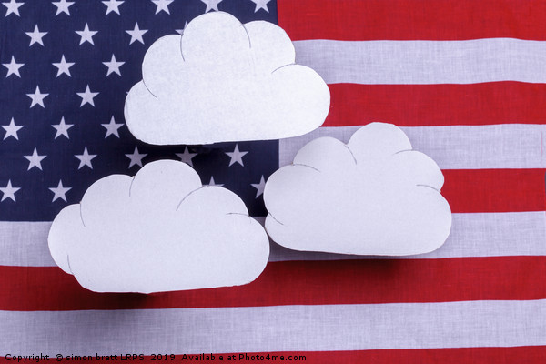 American flag with three white clouds floating abo Picture Board by Simon Bratt LRPS