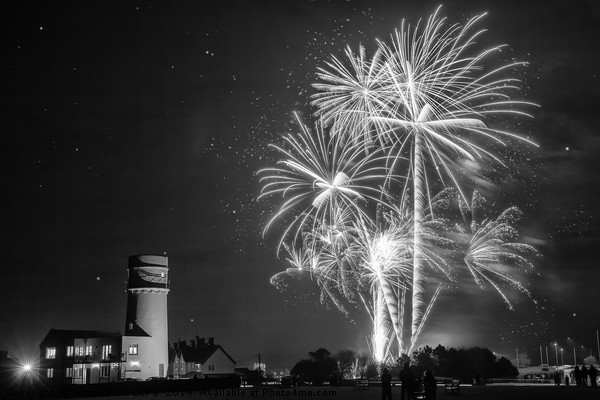 Amazing fireworks at night over lighthouse Picture Board by Simon Bratt LRPS