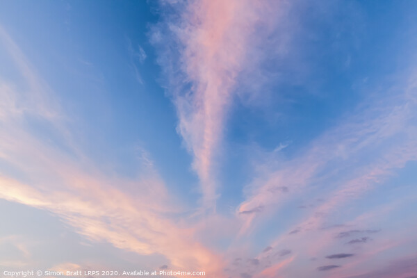 Pink cloud lines and blue skies Picture Board by Simon Bratt LRPS