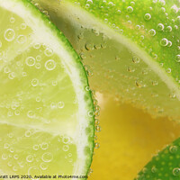 Buy canvas prints of Lemon and lime slices in water by Simon Bratt LRPS