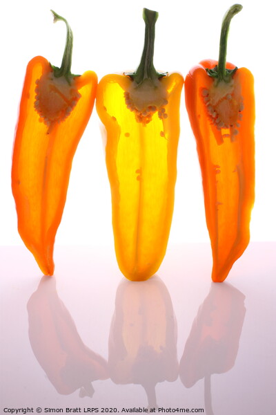 Peppers in half with light through them Picture Board by Simon Bratt LRPS