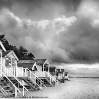 Buy canvas prints of Wells next The Sea Beach huts in black and white on sandy coast by Simon Bratt LRPS
