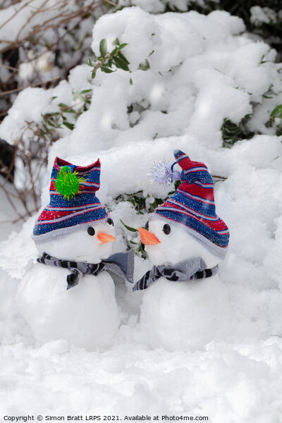 Two cute little snowmen dressed for snow Picture Board by Simon Bratt LRPS
