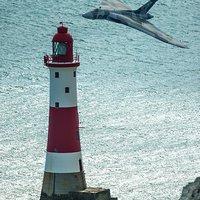 Buy canvas prints of  The Vulcan rounds Beachy Head lighthouse during h by Max Stevens