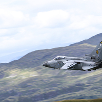 Buy canvas prints of  RAF Tornado F3 of 111 sqn flies low through Snowd by Max Stevens