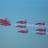 Buy canvas prints of  Red Arrows formation low over the sea by Max Stevens