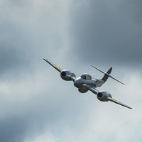 Buy canvas prints of  Gloster Meteor comes out of a stormy sky by Max Stevens
