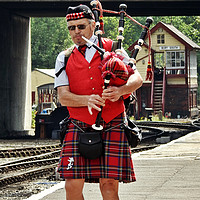Buy canvas prints of Lone bagpiper by Derrick Fox Lomax