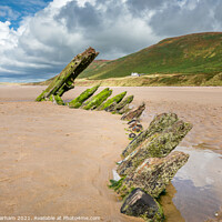 Buy canvas prints of Old shipwreck on Rhosilli beach on the Gower by Chris Warham