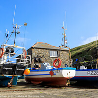 Buy canvas prints of Boats on Mullion Cove slipway pulled up to avoid a storm . by Chris Warham