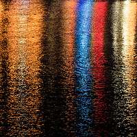 Buy canvas prints of Multicoloured lights refelcted in water  by Chris Warham