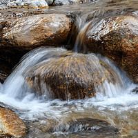 Buy canvas prints of Water splashing over rocks in a mountain stream by Chris Warham