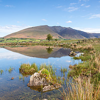 Buy canvas prints of Blencathra reflections in Tewet Tarn by Chris Warham